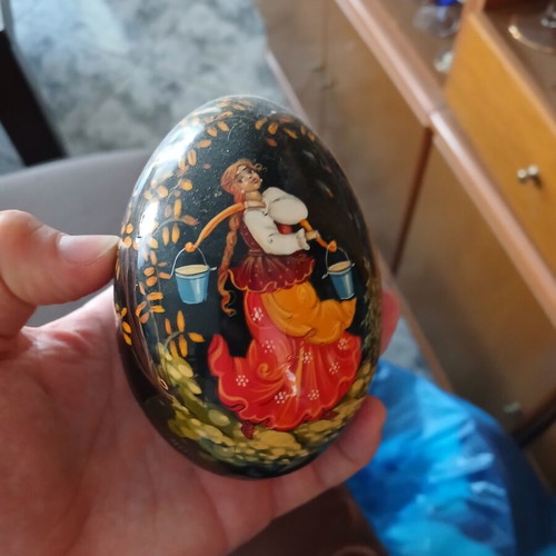 Handmade wooden decorative egg with black lacquer background, Russian art