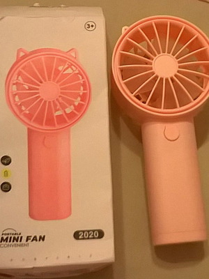 Pink Mini Fan like new with stable base, battery operated
