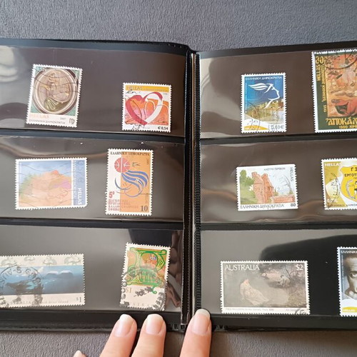 Stamp album with 120 stamps like new, Greece Australia Cyprus Germany America Canada