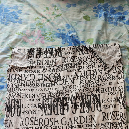 White short-sleeve cotton blouse with letters like new