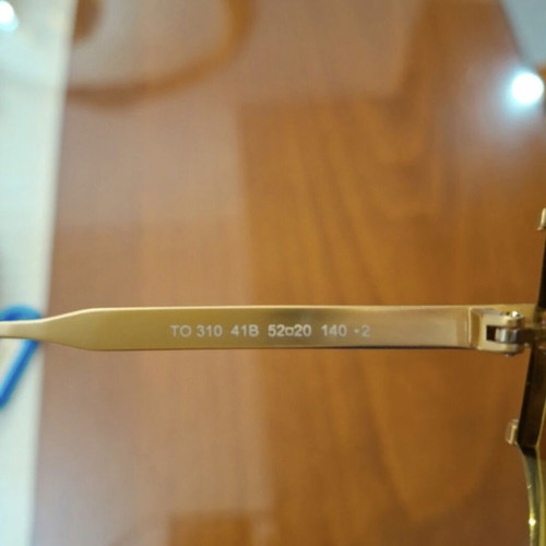Tod's sunglasses new, gold color