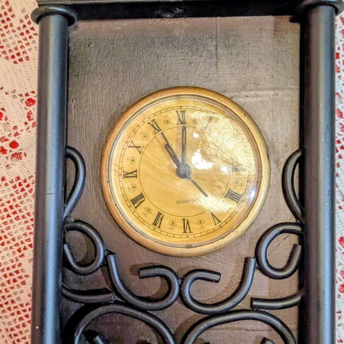 Vintage decorative tabletop clock with wooden and wrought iron details