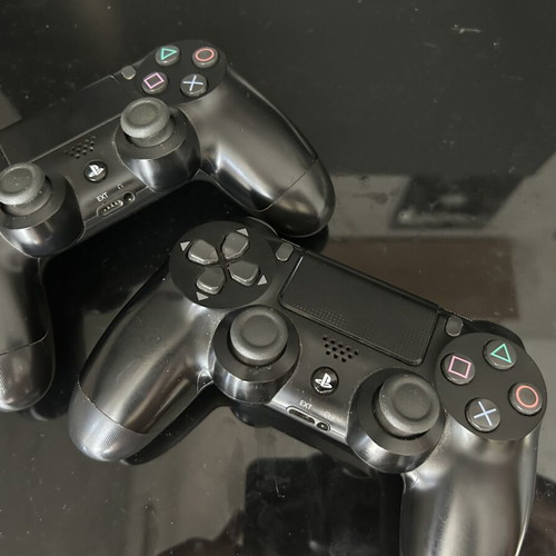 PlayStation 4 Slim 1TB like new with 2 controllers and 6 games