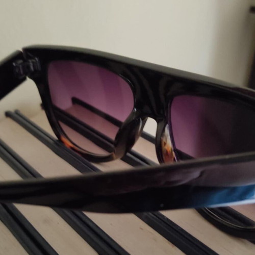 Women’s sunglasses new with case, black frame and brown lenses