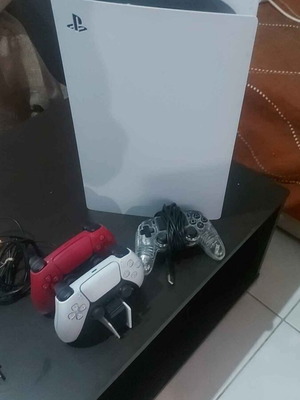 PlayStation 5 Digital Edition 1TB like new with charging base and extra wired controller