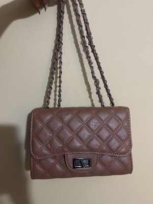 Brown quilted shoulder bag used with adjustable double strap