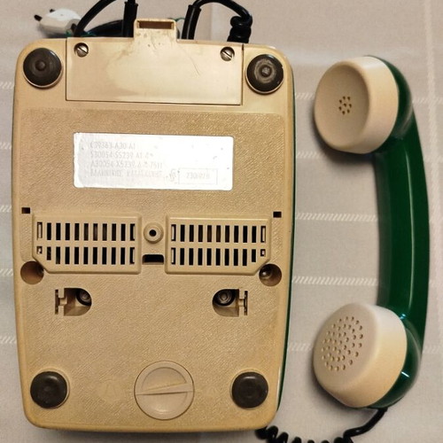Old green wired telephone, functional