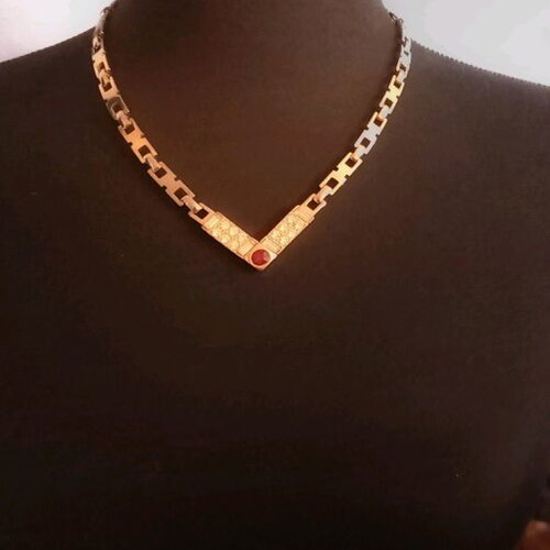 Necklace like new, gold color with white and red stones