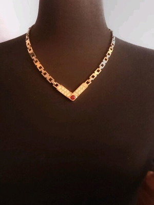Necklace like new, gold color with white and red stones