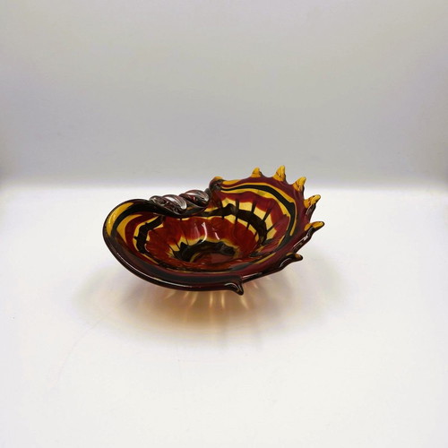 Glass ashtray used red with shell design