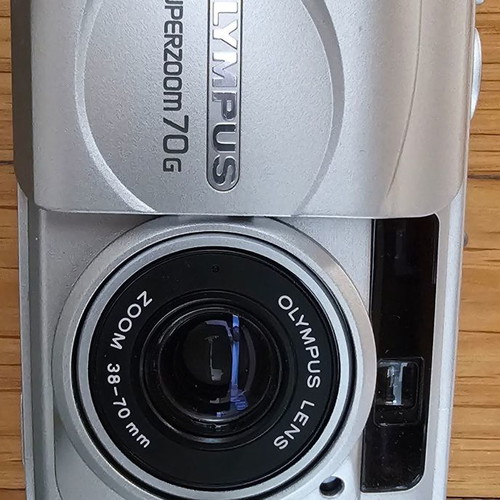 Olympus Superzoom 70G camera used with case