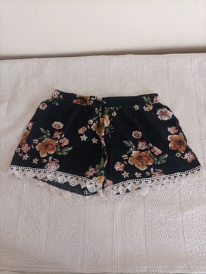 Women's summer shorts used, black with floral pattern, size S