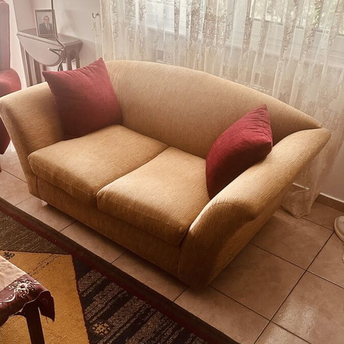 Two-seater sofa like new with elegant design and beige upholstery