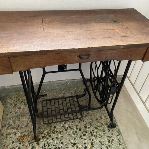 Naumann sewing machine used with cabinet and wheel