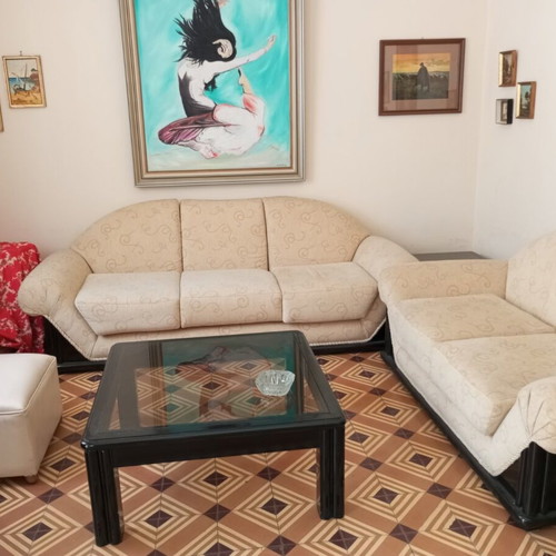 2 sofas with a free armchair