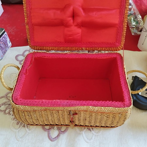 Vintage wicker sewing box with floral decoration used