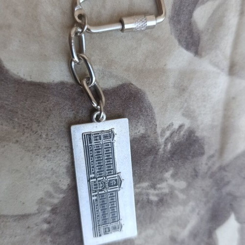 National Bank of Greece metal souvenir keychain with embossed historic building