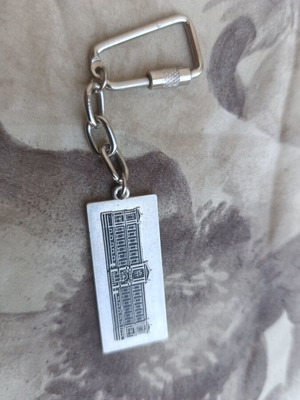 National Bank of Greece metal souvenir keychain with embossed historic building