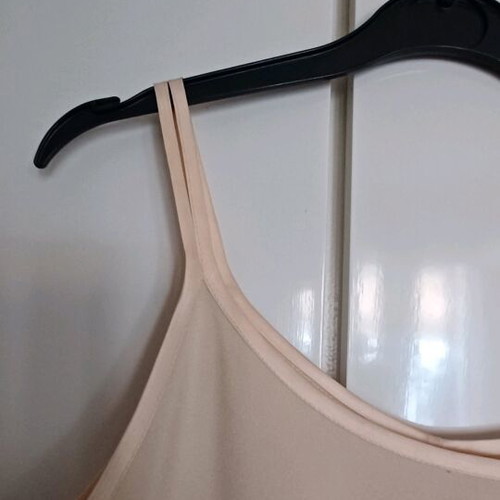 Sleeveless blouse with satin detail and side zipper, size small like new
