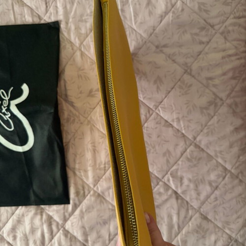 Axel yellow envelope bag like new with zipper and inner pockets