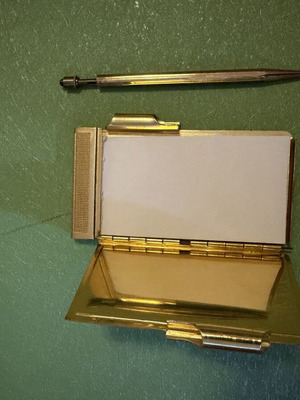Vintage metal pocket notebook used with mechanical pencil and embroidery