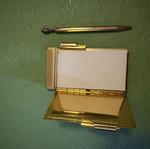 Vintage metal pocket notebook used with mechanical pencil and embroidery