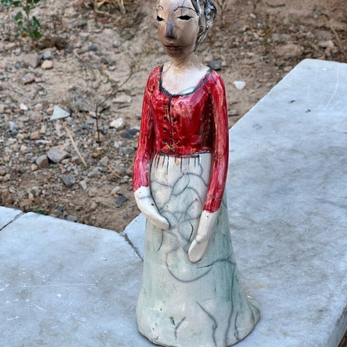 Handmade artistic ceramic woman statue used with rustic style