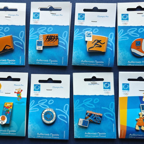 Athens 2004 Olympic Pins collection with official Ensimon catalog