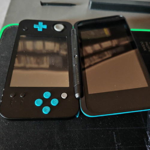 Nintendo 2DS XL like new with stylus, charger, and 4GB SD card