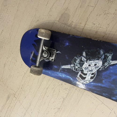 Skateboard used with satellite design on bottom
