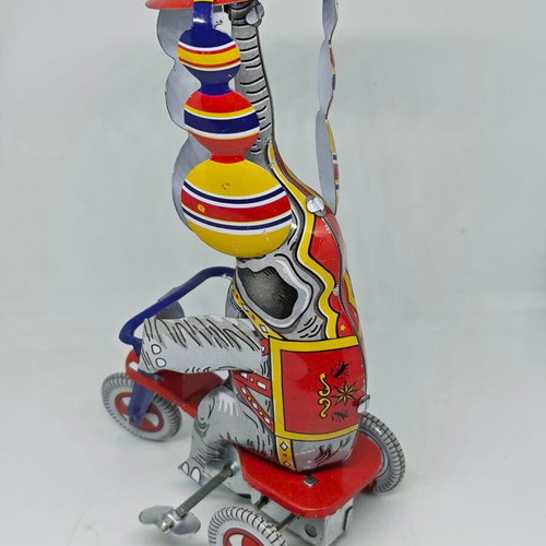 Vintage metal elephant on tricycle like new