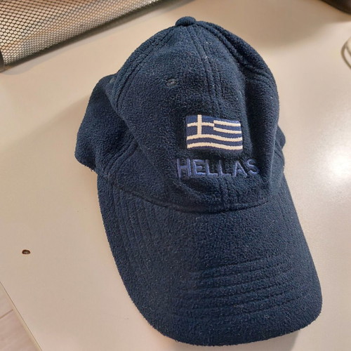 Fleece jockey hat like new, dark blue with national emblem