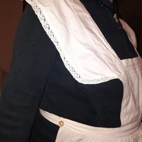 Traditional white kitchen apron with shoulders, buttons at back