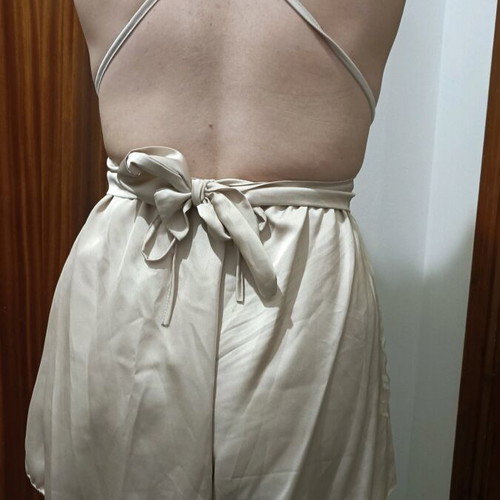 One-piece mini romper like new, gold with crisscross back