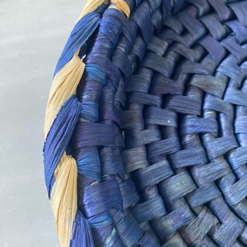 Blue handmade wicker basket with painted porcelain handles like new
