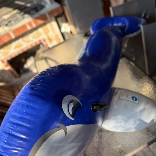 Inflatable dolphin float, blue, with side handles