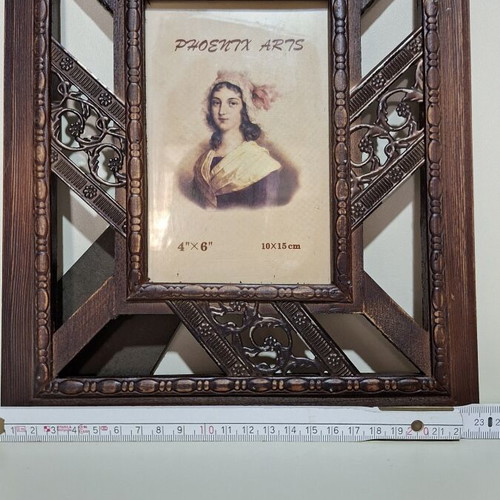 Wooden frame with metal details like new, classic decoration