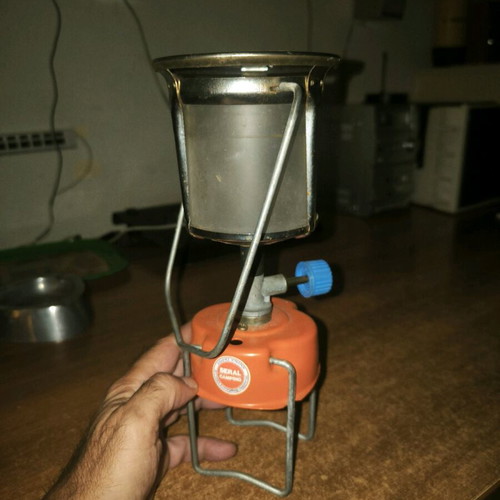 Camping gas lamp used with its protective cage