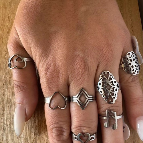 Steel ring set with hearts, geometric and floral designs