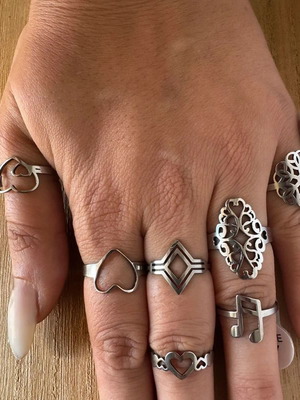 Steel ring set with hearts, geometric and floral designs