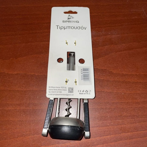 Spring metal corkscrew with non-slip handles