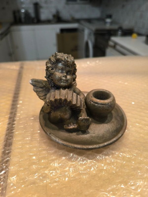 Decorative candlestick with child figure like new
