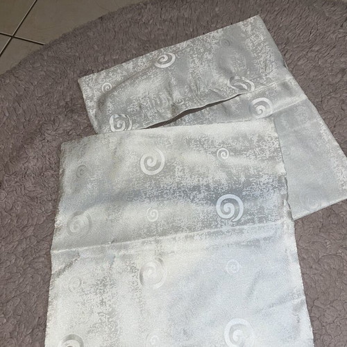 White pillowcases with patterns like new