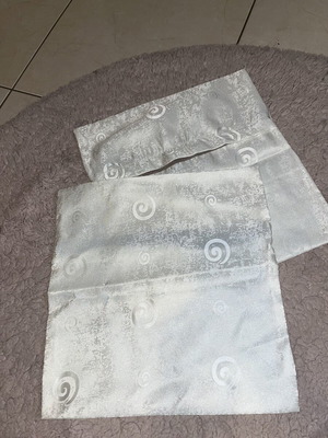 White pillowcases with patterns like new
