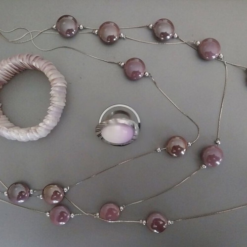 Jewelry set used in lilac shades with necklace, ring, and shell bracelet