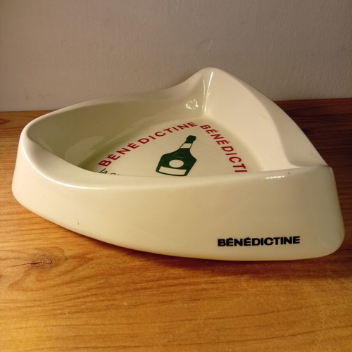 Collectible vintage ceramic ashtray with Benedictine logo used