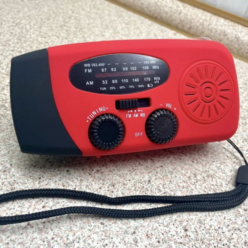 Multifunctional Emergency Gadget with FM Radio, Powerbank, Solar and Hand Charging, Flashlight