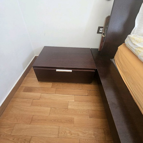 Wooden double bed Casa di Patsi used with storage space