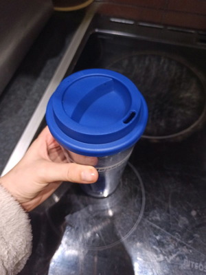 Plastic cup used with blue lid