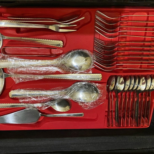 Stainless steel cutlery with gold plating new in their case